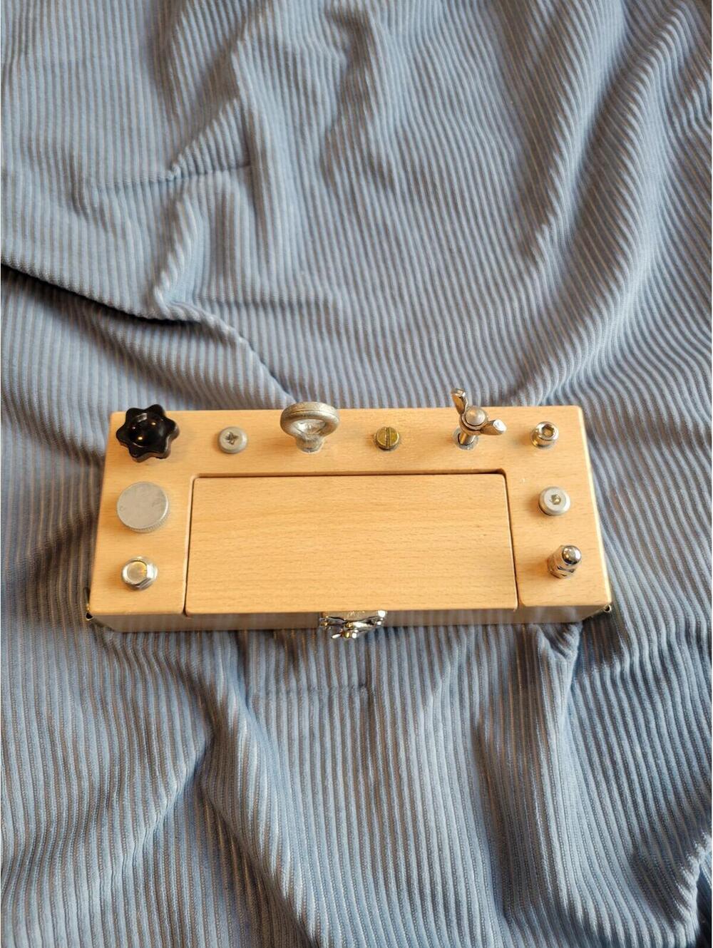 Wooden Box with Multiple Bolts and Knobs